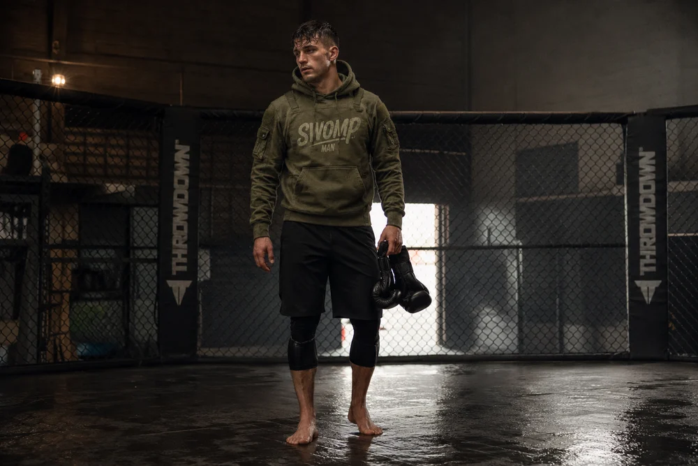 Olive SWOMP MAN hoodie, worn after training.