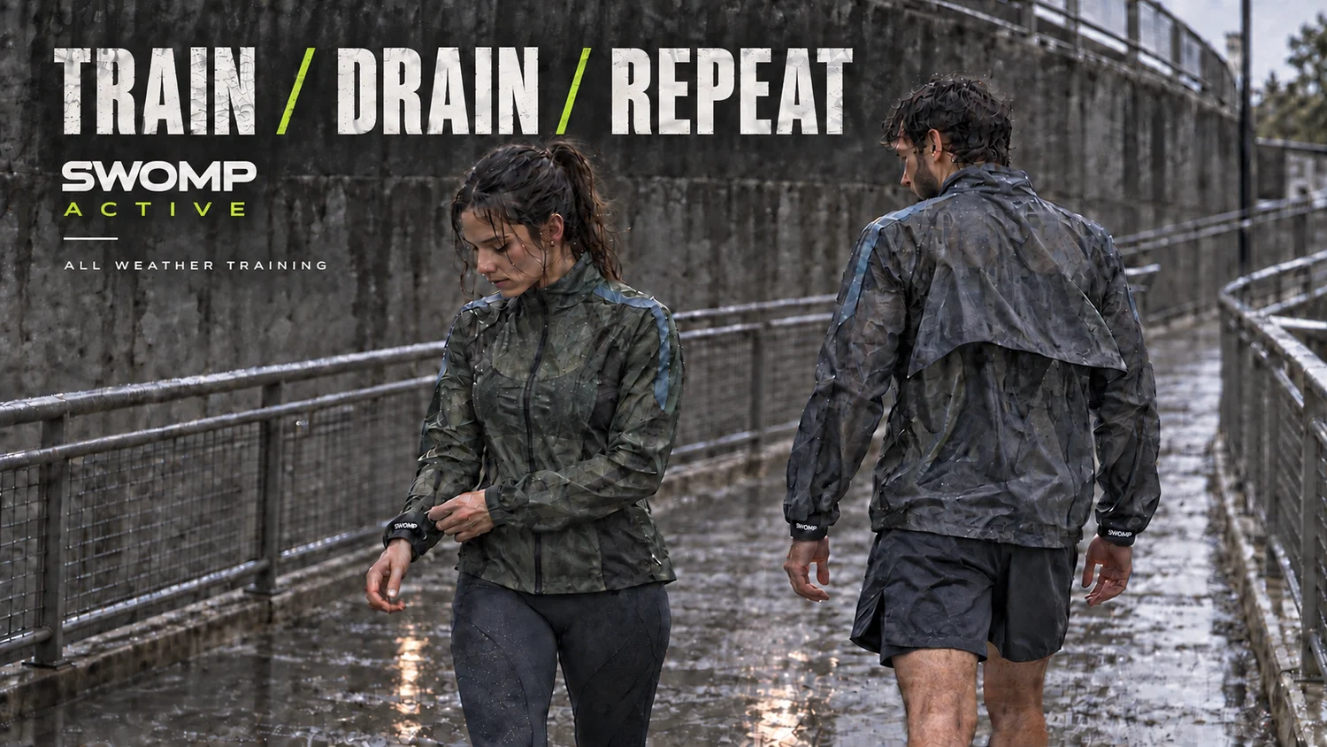Forest green and dark blue rain jackets worn on a wet urban walkway. Train, drain, repeat.